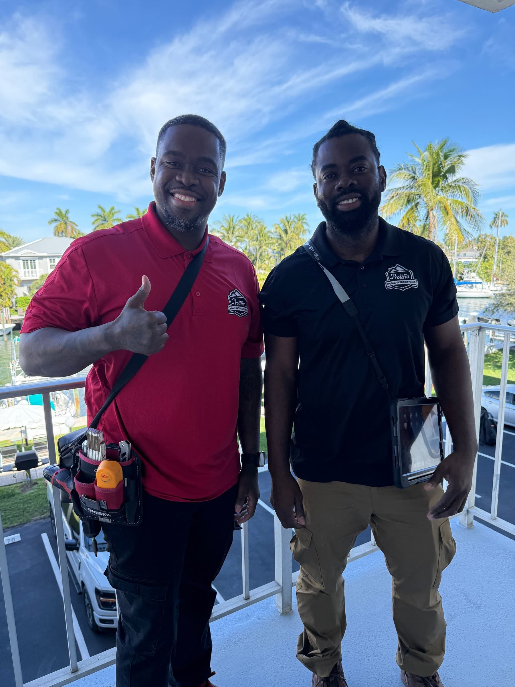 Prolific Home Inspections team on a Florida waterfront balcony