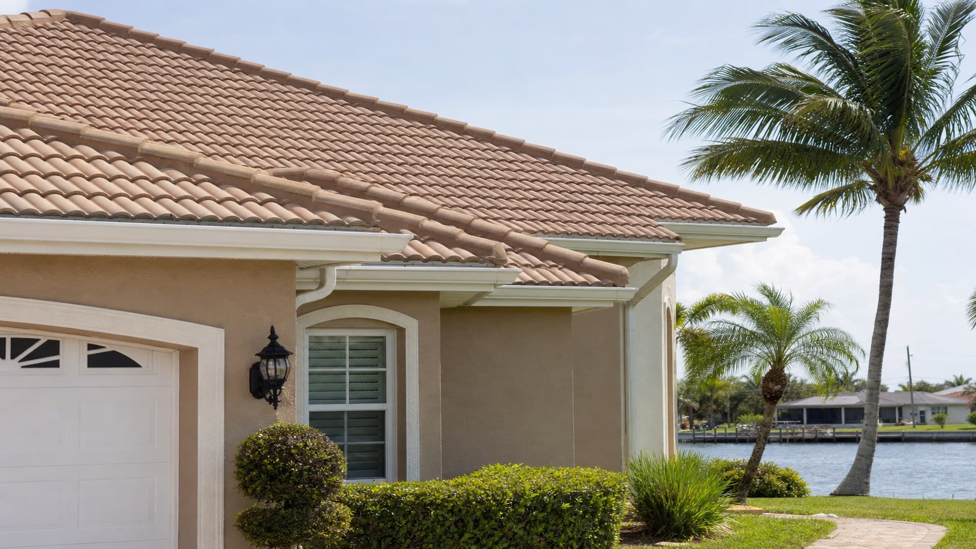 Waterfront home exterior and tile roof in South Florida